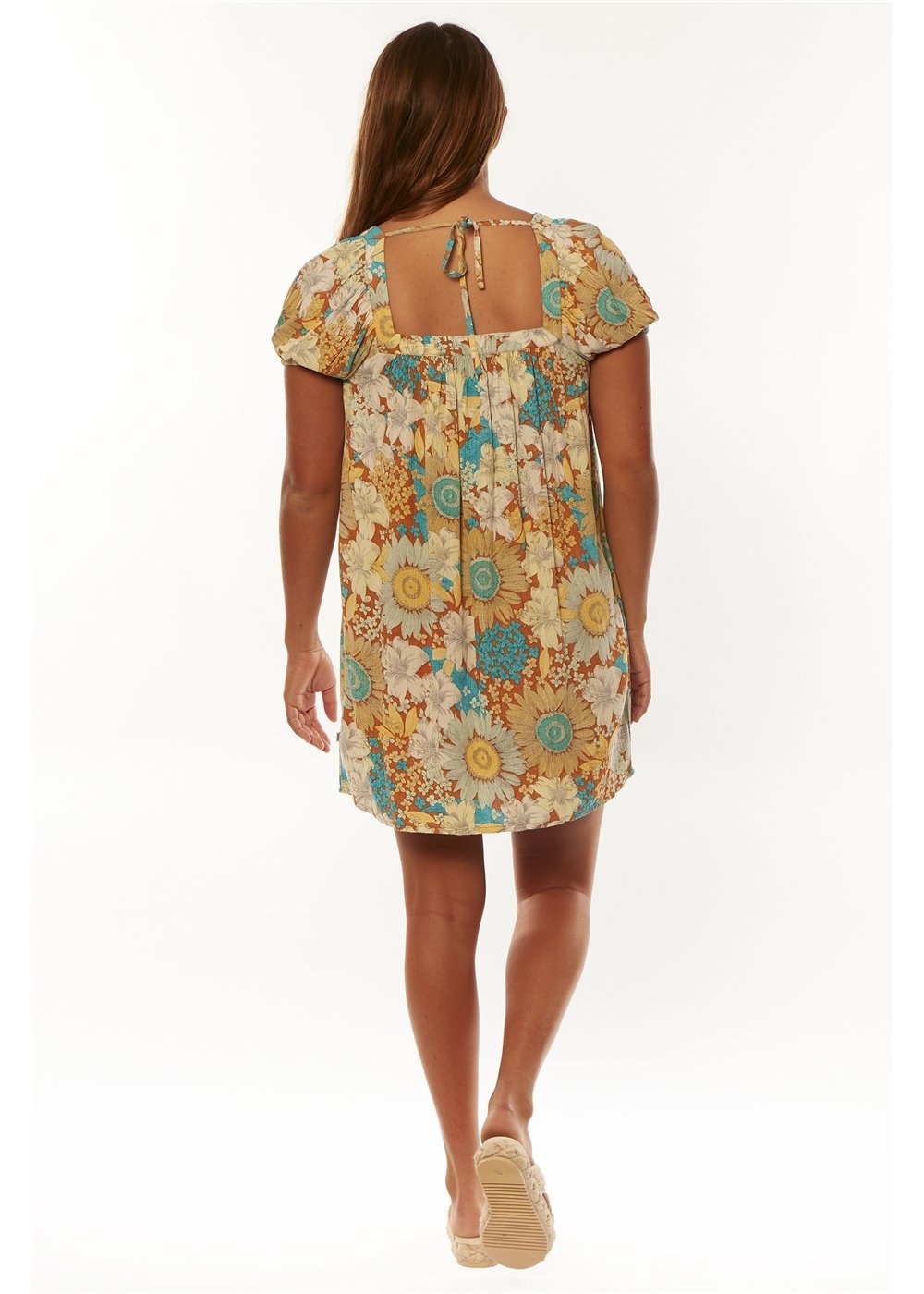 back of Woman wearing a floral dress on a white background